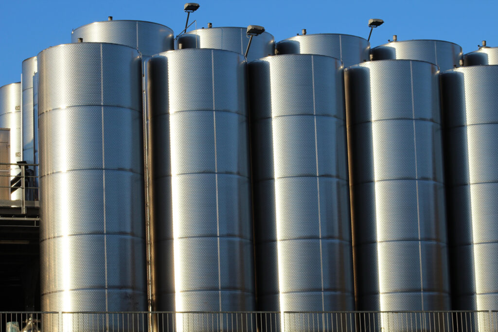 Site selection and sanitary liquid storage silos for food processing plants